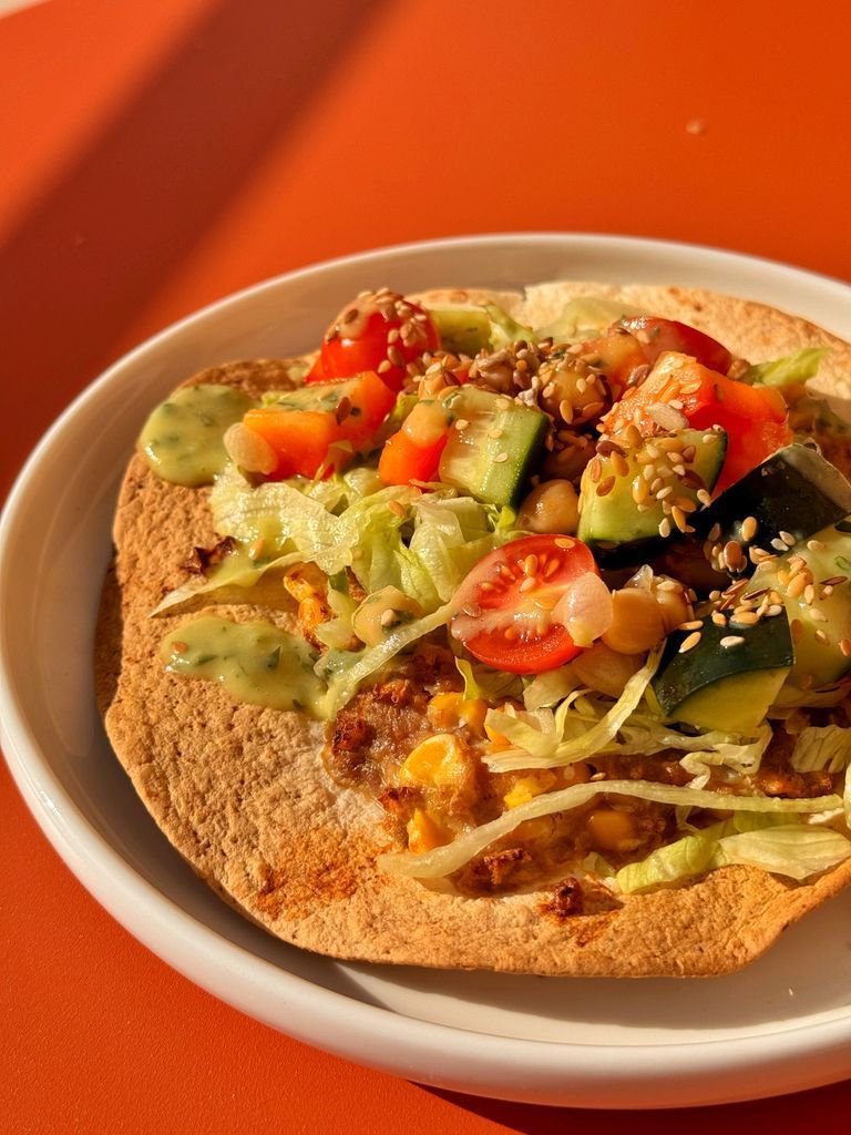 Meat tortillas with vegetables and avocado sauce