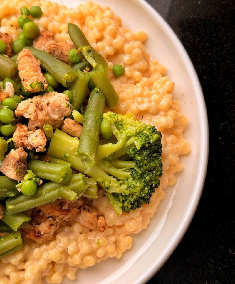 Ptitim with turkey and cheese sauce