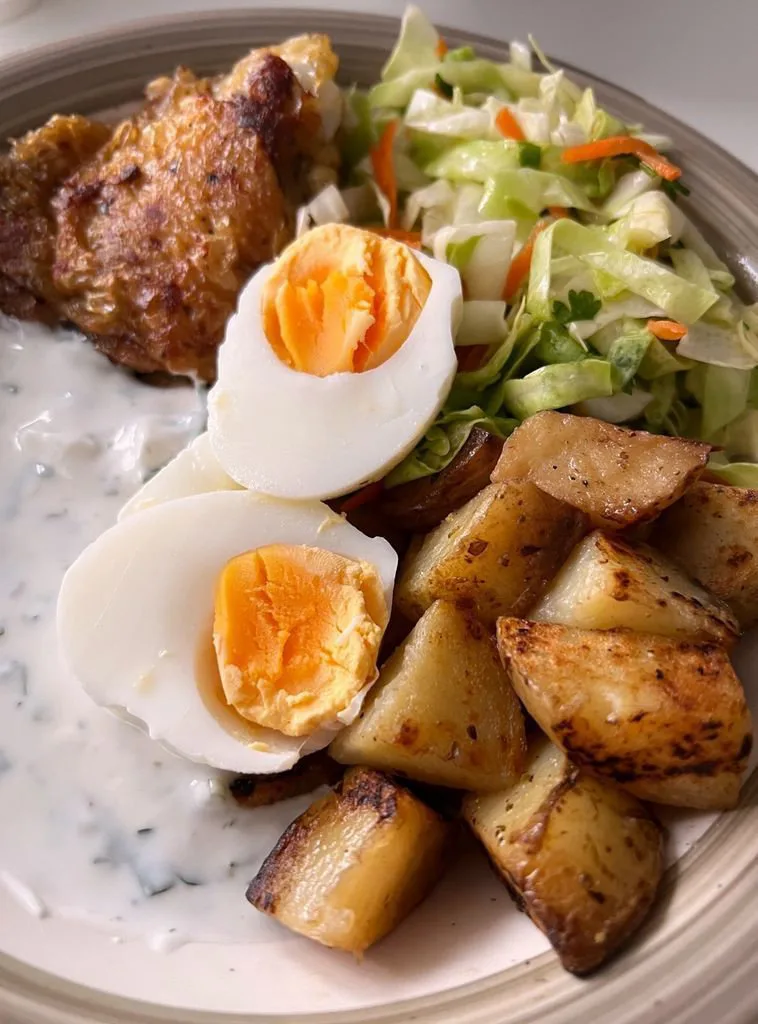 Stewed potatoes with chicken and cabbage salad
